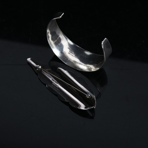 839 - ULRICH - a modernist Danish sterling silver torque bangle, and a sterling silver leaf design brooch ... 