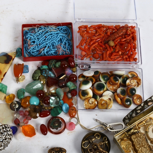 843 - A collection of operculum shells, turquoise and coral beads, pair of hat pins, various other beads a... 