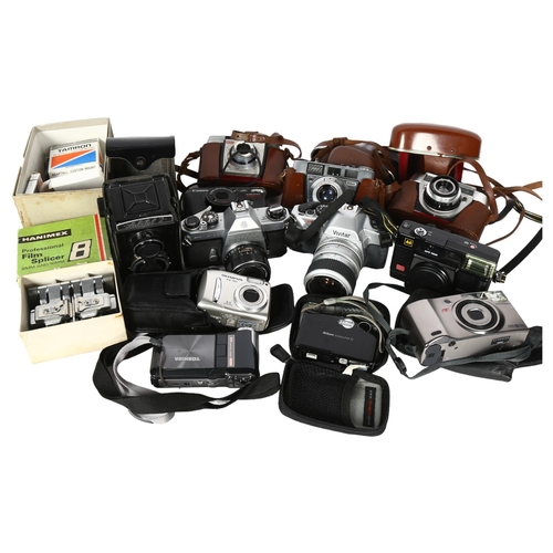 671 - A collection of Vintage cameras, including a Pentax Spotmatic F, Lubitel 2, Kodak cameras, Olympus c... 