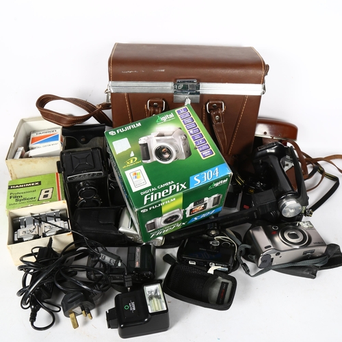 671 - A collection of Vintage cameras, including a Pentax Spotmatic F, Lubitel 2, Kodak cameras, Olympus c... 