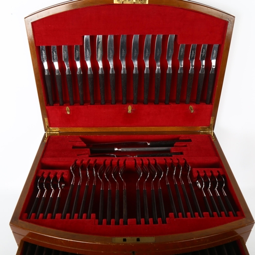 63 - A complete canteen of cutlery, by Joseph Rodgers, Sheffield, Manhattan pattern, in mahogany cabinet,... 