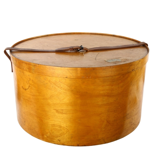 85 - A large early 20th century Luterma bent ply hat box, with leather strap, stamped outside of base and... 