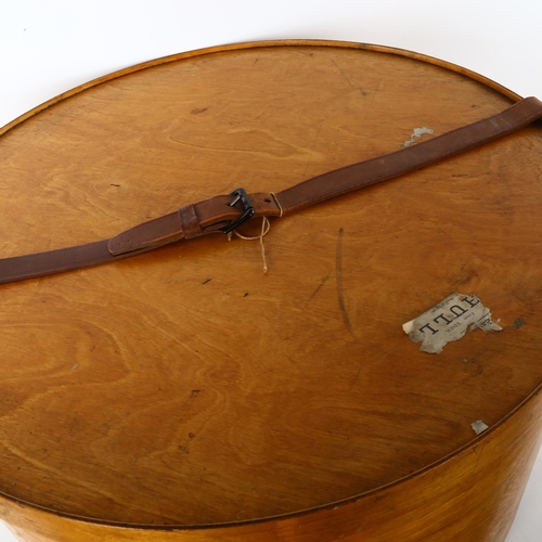 85 - A large early 20th century Luterma bent ply hat box, with leather strap, stamped outside of base and... 