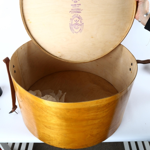 85 - A large early 20th century Luterma bent ply hat box, with leather strap, stamped outside of base and... 