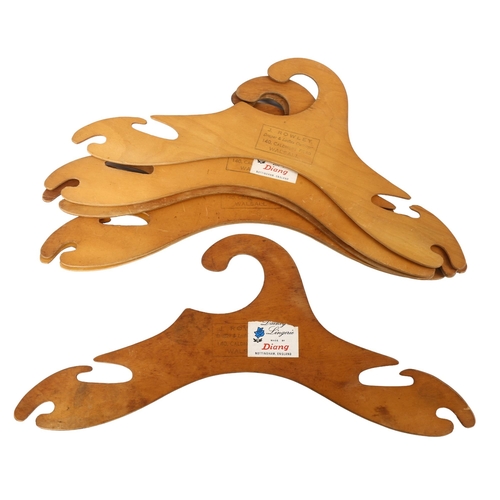 88 - A set of modernist plywood coat hangers