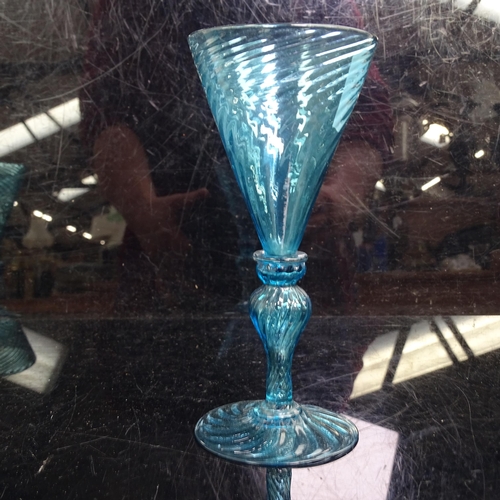 352 - A set of 6 Wrythen blue glass goblets, H 13cm. 1 A/F