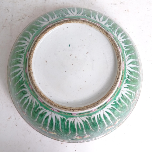 456 - A green ground Chinese bowl with stylised floral decoration, diameter 33cm