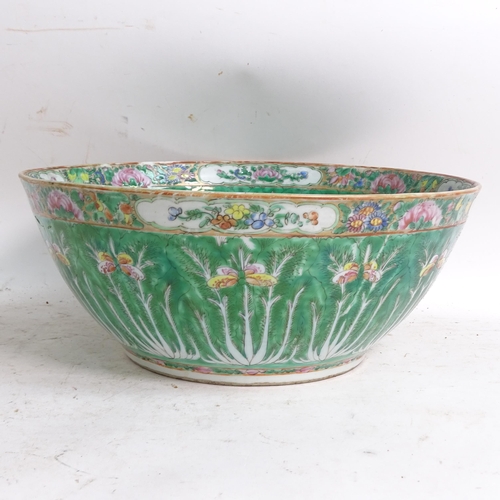 456 - A green ground Chinese bowl with stylised floral decoration, diameter 33cm