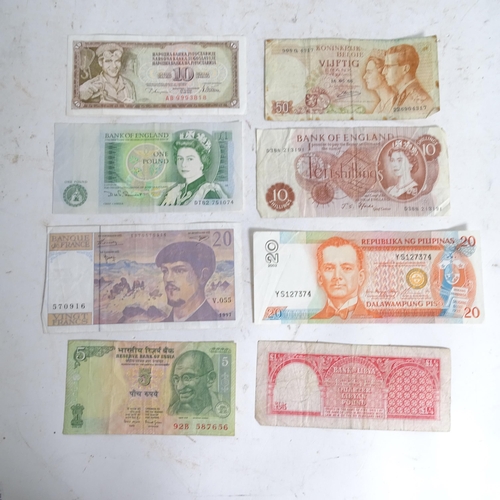 122 - A collection of various world banknotes, including American dollars, Indian, Trinidad and Tobago etc... 