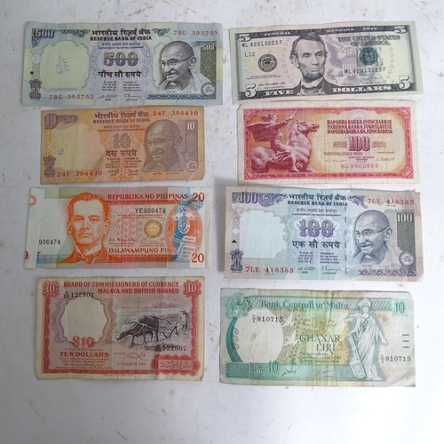 122 - A collection of various world banknotes, including American dollars, Indian, Trinidad and Tobago etc... 