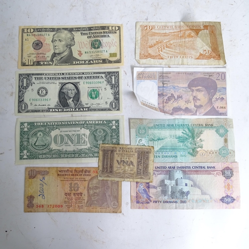 122 - A collection of various world banknotes, including American dollars, Indian, Trinidad and Tobago etc... 