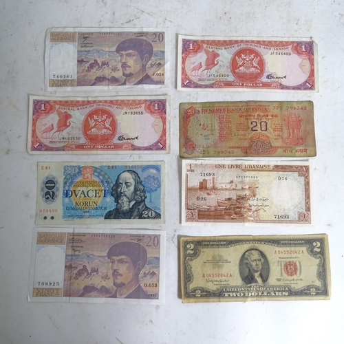 122 - A collection of various world banknotes, including American dollars, Indian, Trinidad and Tobago etc... 