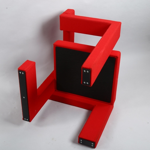 103 - Gerrit Rietveld, a Steltman chair by Rietveld Originals, the assymetrical wooden structure with red ... 