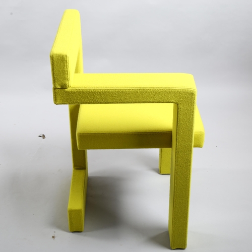 104 - Gerrit Rietveld, a Steltman chair by Rietveld Originals, the assymetrical wooden structure with yell... 