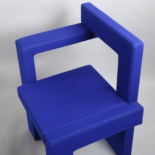 105 - Gerrit Rietveld, a Steltman chair by Rietveld Originals, the assymetrical wooden structure with blue... 