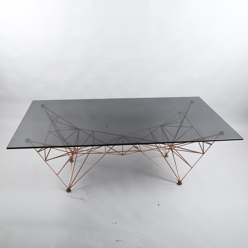 112 - Tom Dixon, a Pylon coffee table, black glass top on copper base, height 46cm, 135 x 75cm