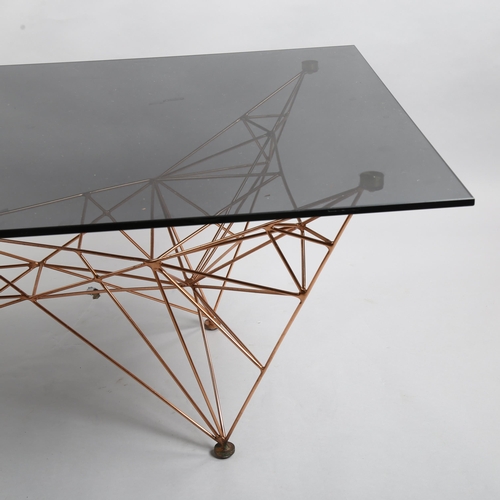 112 - Tom Dixon, a Pylon coffee table, black glass top on copper base, height 46cm, 135 x 75cm
