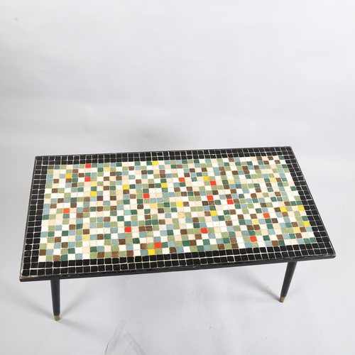 17 - A 1950s' mosaic tile top coffee table, with ebonised surround and legs, 93 x 47cm, height 42cm