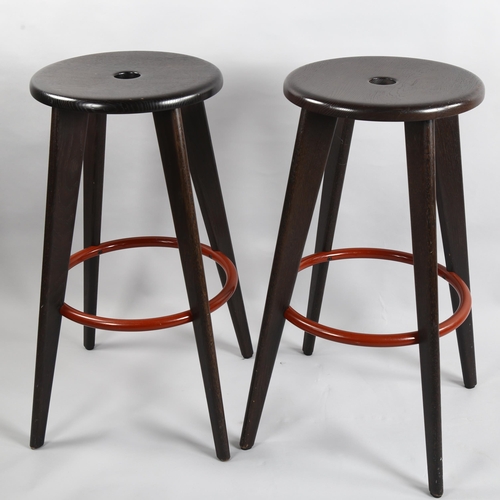 65 - Jean Prouve, a pair of Tabouret Hallway stained oak barstools by Vitra, height 78cm