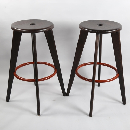 66 - Jean Prouve, a pair of Tabouret Hallway stained oak barstools by Vitra, height 78cm