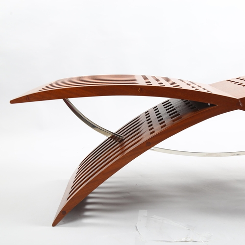 74 - Tressera, a Gavina sculptural bench in iroko and polished stainless steel, designed by Jaime Tresser... 