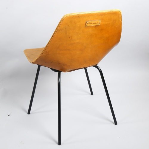 75 - Pierre Guariche, France, a Tonneau chair, the leather clad shell seat on black tubular steel legs, m... 