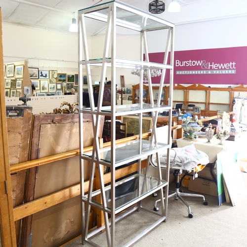 93 - A late 20th century brushed steel frame display stand with toughened glass shelves, height 209cm x 9... 