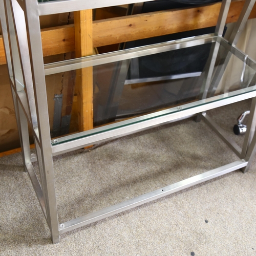 93 - A late 20th century brushed steel frame display stand with toughened glass shelves, height 209cm x 9... 