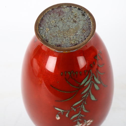 170 - A Japanese red ground cloisonne enamel vase, decorated with exotic flowers, late 19th/early 20th cen... 