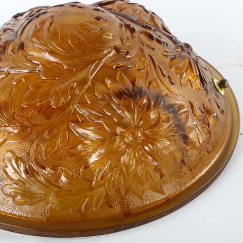 174 - A French amber glass plafonnier, relief moulded floral design, original buttons, new cords and wirin... 