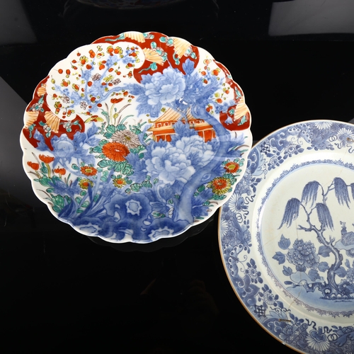 190 - An 18th century Chinese blue and white plate with hand painted decoration, diameter 32cm (restored),... 