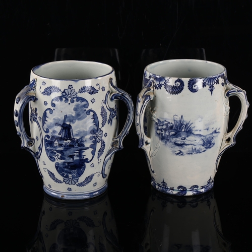 202 - A pair of Royal Bonn blue and white transfer decorated 3-handled vases, height 18cm