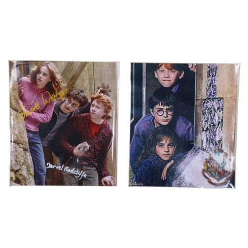 203 - Harry Potter, photograph with original signatures of Daniel Radcliffe, Emma Watson, and Rupert Grint... 