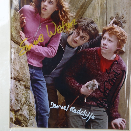 203 - Harry Potter, photograph with original signatures of Daniel Radcliffe, Emma Watson, and Rupert Grint... 