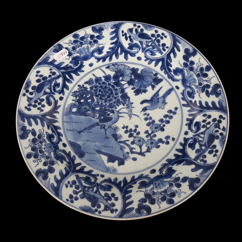 220 - A Chinese blue and white porcelain plate decorated with birds, diameter 32cm