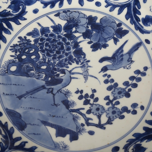 220 - A Chinese blue and white porcelain plate decorated with birds, diameter 32cm