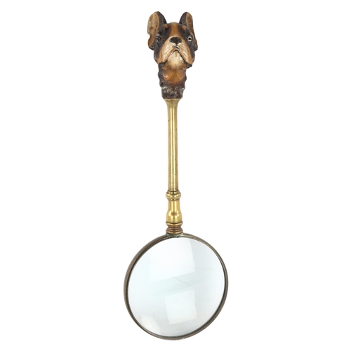 239 - A brass magnifying glass, with carved and painted wood handle in the form of a French Terrier, lengt... 