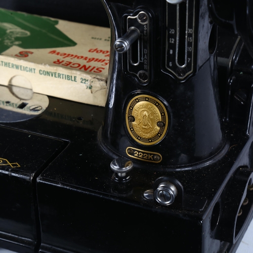 241 - An early portable Singer sewing machine, model 222K, in original box with papers and accessories