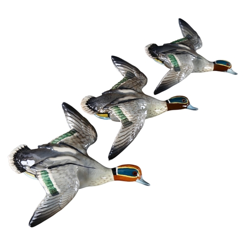 264 - A set of 3 Beswick graduated Flying Teal Ducks, designed by Arthur Gredington, makers stamp, models ... 