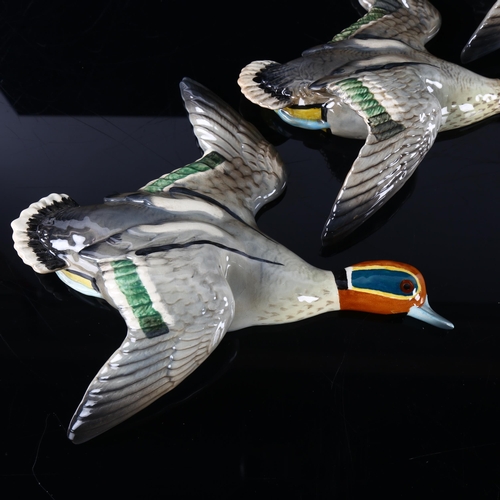 264 - A set of 3 Beswick graduated Flying Teal Ducks, designed by Arthur Gredington, makers stamp, models ... 