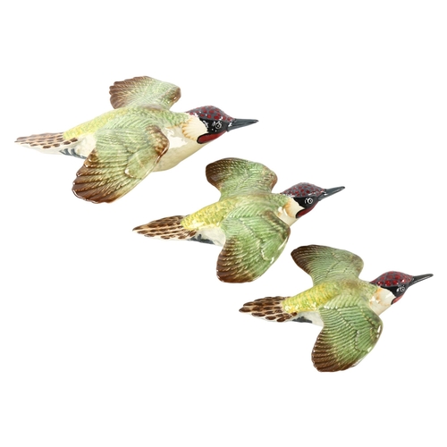 270 - A set of 3 Beswick wall-hanging Woodpeckers, model 1344-1-2-3, makers marks, longest 20cm