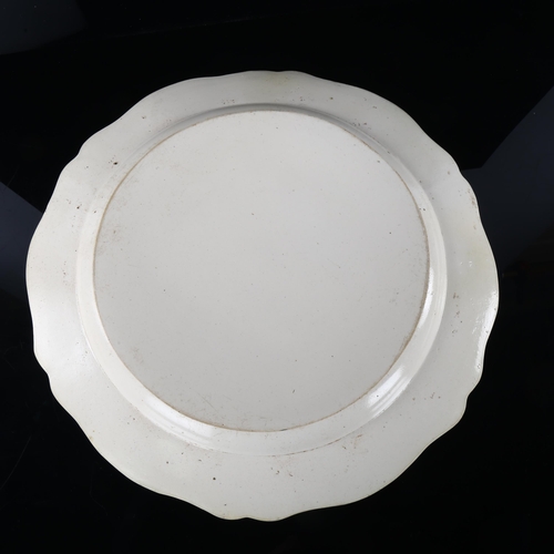 277 - A 18th century salt glazed pottery serving platter, with shaped moulded lattice surround, diameter 4... 