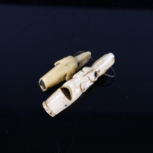 279 - 2 x 19th century carved bone dog's head design whistles with glass eyes, largest length 6.5cm