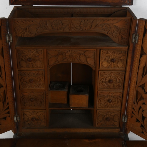 304 - An 19th century carved walnut stationary box, A/F,  height 25cm