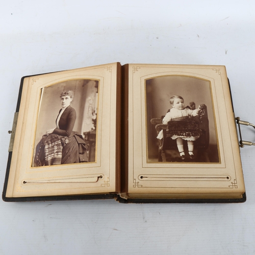 305 - A Victorian photo album with cushioned leather bound cover,  22 x 18cm