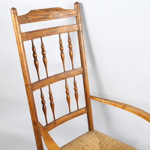 178 - Neville Neal, an Arts and Crafts Cotswold School Ernest Gimson design spindle back rocking chair in ... 