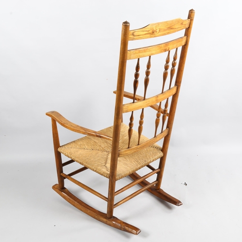 178 - Neville Neal, an Arts and Crafts Cotswold School Ernest Gimson design spindle back rocking chair in ... 