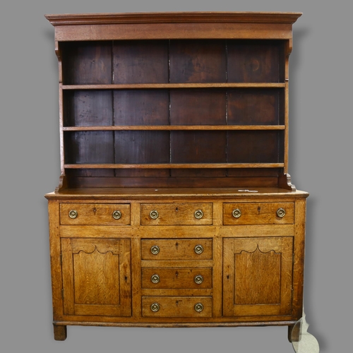 235 - George III oak Welsh dresser, with boarded open plate rack, and drawers and cupboards below, width 1... 