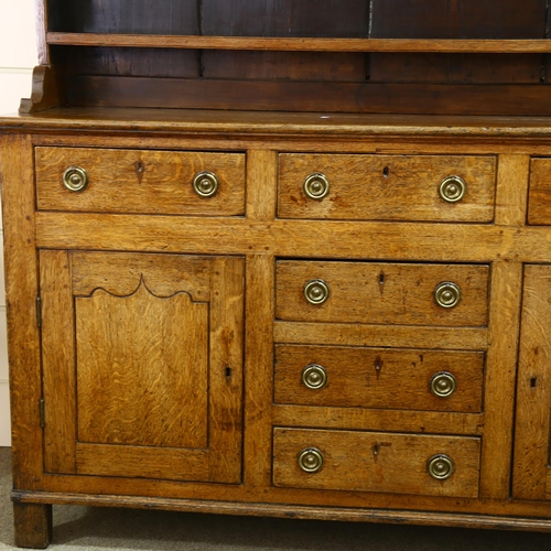 235 - George III oak Welsh dresser, with boarded open plate rack, and drawers and cupboards below, width 1... 