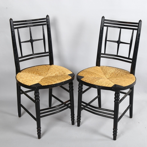 257 - A pair of Morris & Company, Arts and Crafts chairs by Ford Maddox Brown, ebonised frame with rush se... 